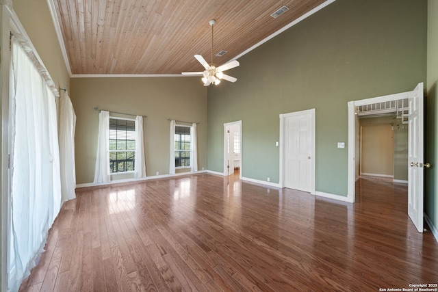 388 Oak, Pipe Creek, TX 78063 - unfurnished living room featuring ornamental molding, a ceiling fan, high vaulted ceiling, wood finished floors, and baseboards