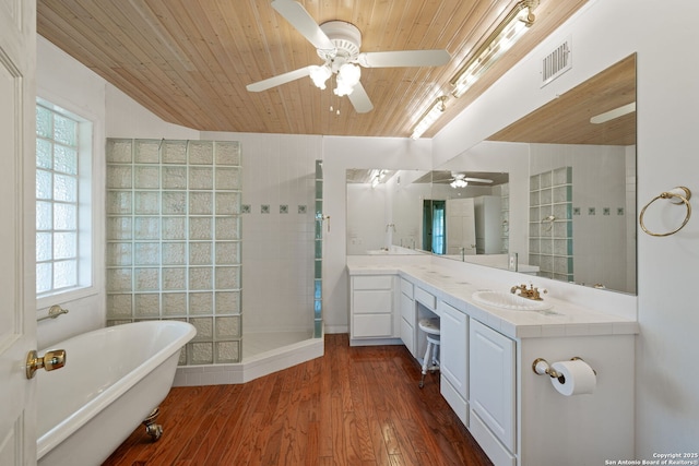 388 Oak, Pipe Creek, TX 78063 - bathroom featuring ceiling fan, a tile shower, plenty of natural light, wooden ceiling, and a freestanding bath