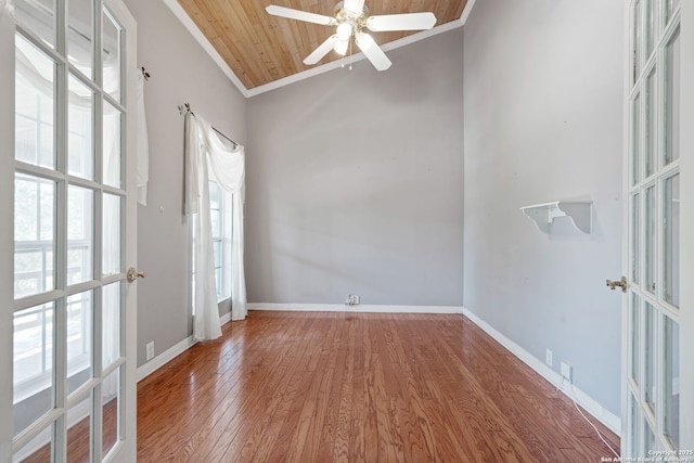 388 Oak, Pipe Creek, TX 78063 - spare room with ornamental molding, wood finished floors, ceiling fan, baseboards, and wooden ceiling