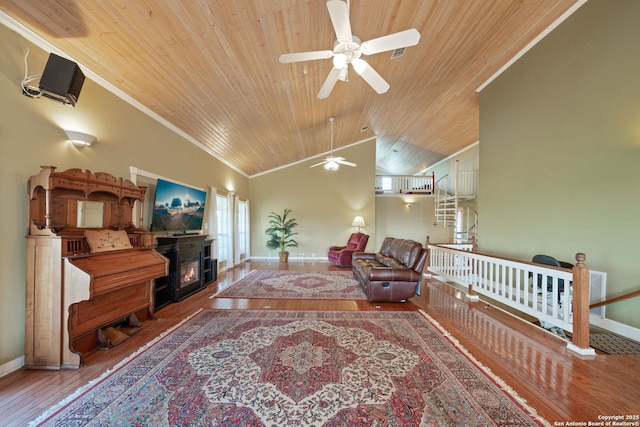 388 Oak, Pipe Creek, TX 78063 - living room featuring a ceiling fan, wooden ceiling, wood finished floors, baseboards, and ornamental molding