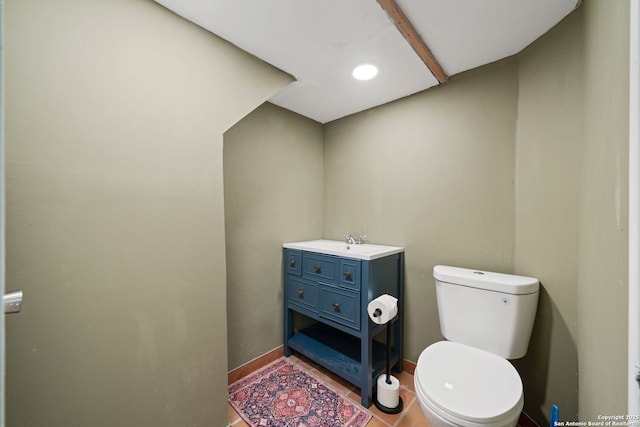 388 Oak, Pipe Creek, TX 78063 - half bath featuring toilet, tile patterned floors, baseboards, and vanity