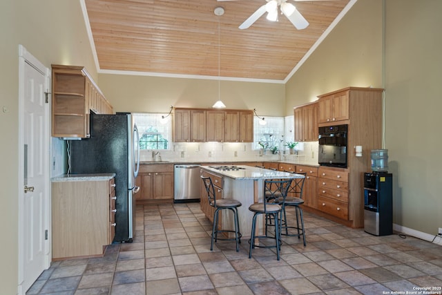 388 Oak, Pipe Creek, TX 78063 - kitchen featuring appliances with stainless steel finishes, wooden ceiling, a ceiling fan, healthy amount of natural light, and high vaulted ceiling