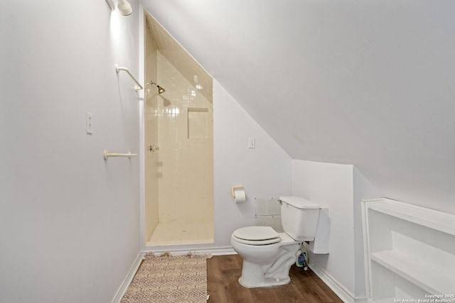 388 Oak, Pipe Creek, TX 78063 - full bathroom featuring a tile shower, toilet, wood finished floors, and baseboards