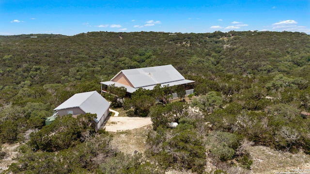 388 Oak, Pipe Creek, TX 78063 - aerial view of property and surrounding area featuring a heavily wooded area