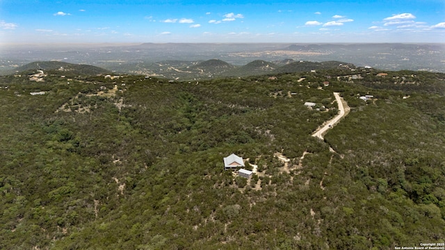 388 Oak, Pipe Creek, TX 78063 - view of property location featuring a forest and mountains
