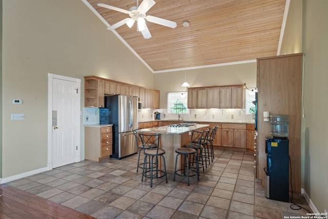 388 Oak, Pipe Creek, TX 78063 - kitchen featuring freestanding refrigerator, high vaulted ceiling, open shelves, backsplash, and a center island
