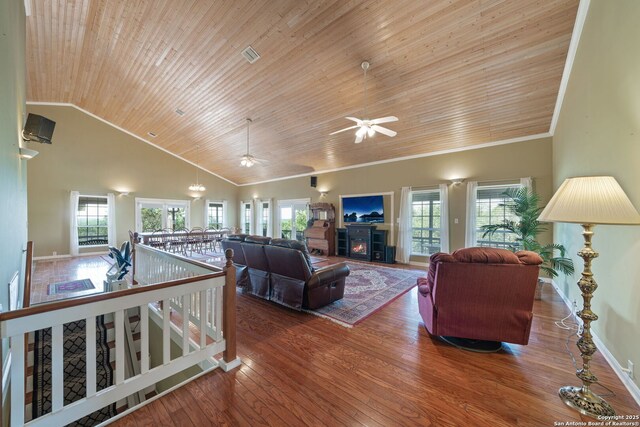 388 Oak, Pipe Creek, TX 78063 - living area with wood ceiling, plenty of natural light, high vaulted ceiling, wood finished floors, and crown molding