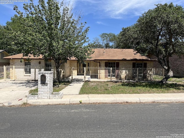 9570 Millers Rdg, San Antonio, TX 78239 - view of front of house featuring brick siding and a fenced front yard