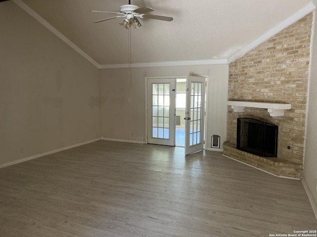 9570 Millers Rdg, San Antonio, TX 78239 - unfurnished living room with lofted ceiling, ceiling fan, wood finished floors, a brick fireplace, and crown molding