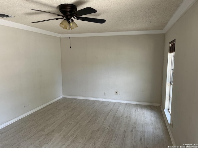 9570 Millers Rdg, San Antonio, TX 78239 - empty room featuring wood finished floors, a textured ceiling, a ceiling fan, baseboards, and crown molding