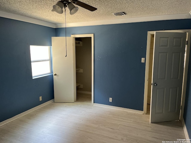 9570 Millers Rdg, San Antonio, TX 78239 - spare room featuring a textured ceiling, ceiling fan, wood finished floors, and baseboards