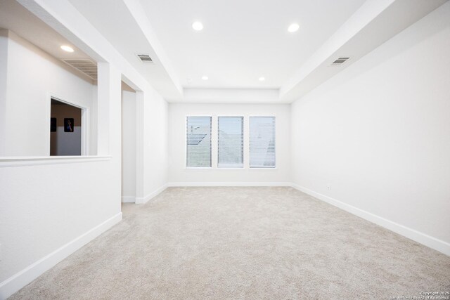 807 Swenson Rnch, San Antonio, TX 78245 - unfurnished room featuring recessed lighting, light carpet, baseboards, and a tray ceiling
