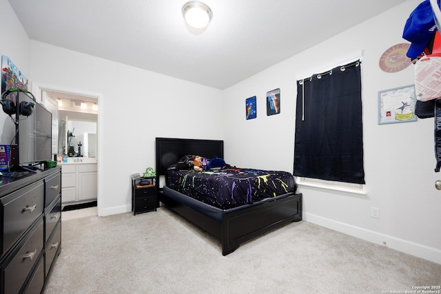 807 Swenson Rnch, San Antonio, TX 78245 - bedroom with light colored carpet, baseboards, and ensuite bathroom