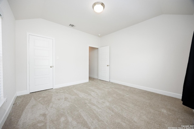 807 Swenson Rnch, San Antonio, TX 78245 - unfurnished bedroom with vaulted ceiling, carpet flooring, and baseboards