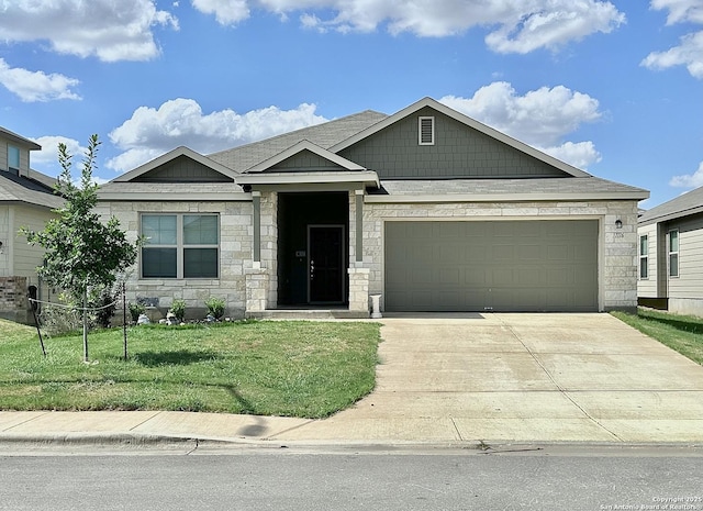 1116 Eagle, Seguin, TX 78155 - view of front facade featuring stone siding, driveway, a front yard, and an attached garage