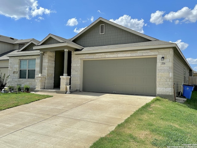 1116 Eagle, Seguin, TX 78155 - view of front of property with stone siding, driveway, a garage, and a front yard