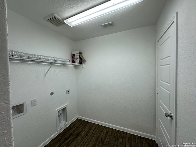 1116 Eagle, Seguin, TX 78155 - laundry room with hookup for an electric dryer, dark wood-style flooring, baseboards, a textured ceiling, and washer hookup