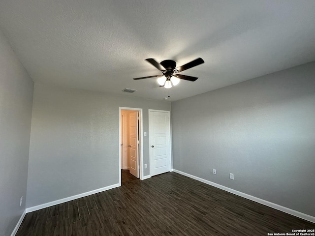 1116 Eagle, Seguin, TX 78155 - unfurnished room with baseboards, dark wood-style floors, and ceiling fan