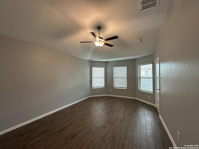 1116 Eagle, Seguin, TX 78155 - spare room with dark wood-style floors, a ceiling fan, baseboards, a textured ceiling, and a smoke detector