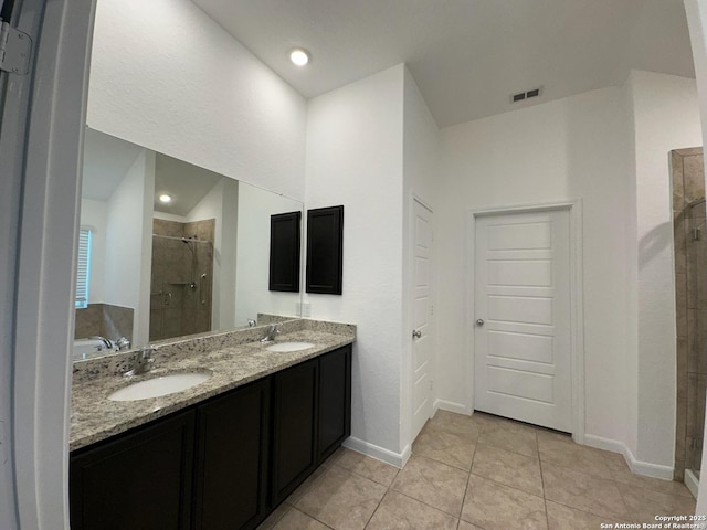 1116 Eagle, Seguin, TX 78155 - bathroom featuring a shower stall, tile patterned flooring, double vanity, baseboards, and a bathtub
