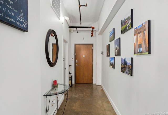 831 S Flores Unit 2201, San Antonio, TX 78204 - hallway featuring concrete flooring and baseboards