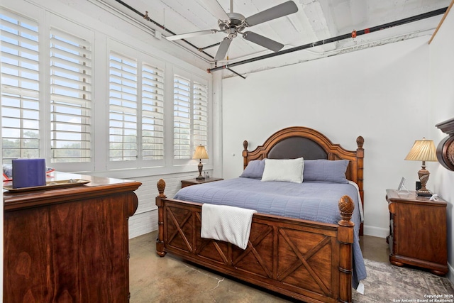 831 S Flores Unit 2201, San Antonio, TX 78204 - bedroom featuring concrete flooring and a ceiling fan