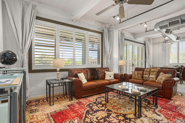 831 S Flores Unit 2201, San Antonio, TX 78204 - living area featuring a ceiling fan and beamed ceiling