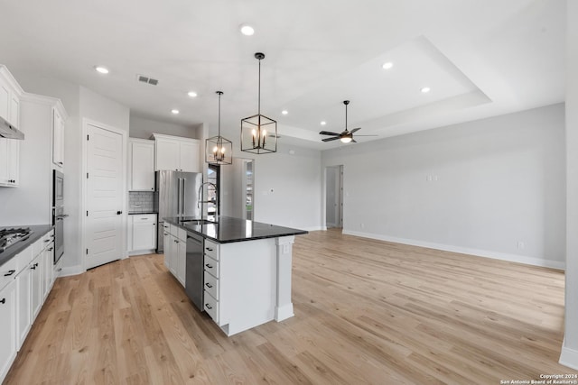 191 Azalea Aly, Castroville, TX 78009 - kitchen featuring dark countertops, stainless steel appliances, a sink, ceiling fan, and white cabinets