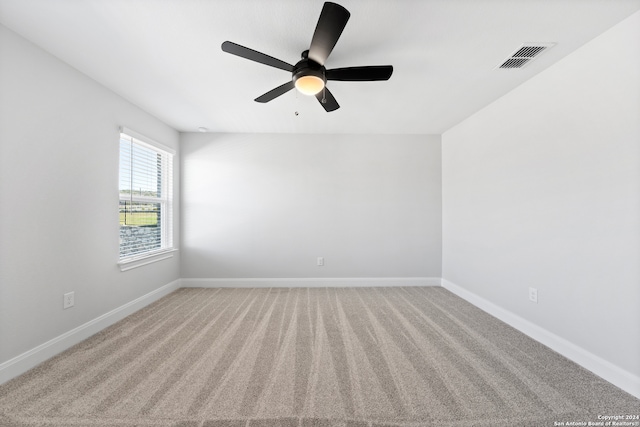 243 Wisteria Vw, Castroville, TX 78009 - empty room featuring light colored carpet, ceiling fan, and baseboards