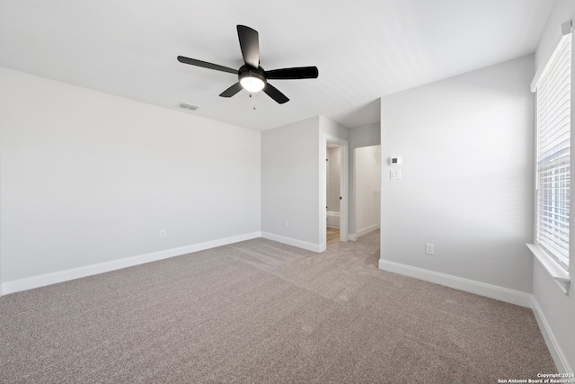 243 Wisteria Vw, Castroville, TX 78009 - unfurnished room with a ceiling fan, light carpet, and baseboards
