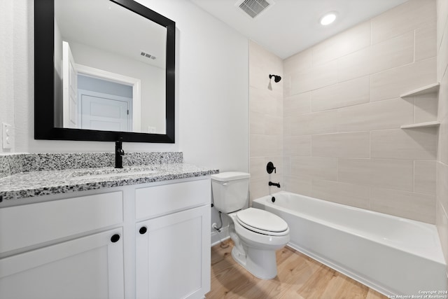 243 Wisteria Vw, Castroville, TX 78009 - full bath featuring wood finished floors, toilet, vanity, and  shower combination