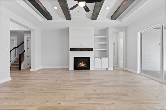 243 Wisteria Vw, Castroville, TX 78009 - unfurnished living room with ceiling fan, light wood-style flooring, baseboards, beamed ceiling, and recessed lighting