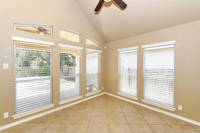 27218 Spiral Cyn, San Antonio, TX 78261 - empty room with ceiling fan, light tile patterned flooring, vaulted ceiling, and baseboards