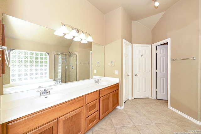 27218 Spiral Cyn, San Antonio, TX 78261 - full bathroom with vaulted ceiling, a stall shower, double vanity, tile patterned floors, and baseboards
