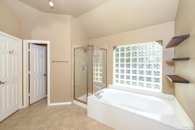 27218 Spiral Cyn, San Antonio, TX 78261 - full bathroom featuring a bath, a shower stall, tile patterned flooring, and vaulted ceiling