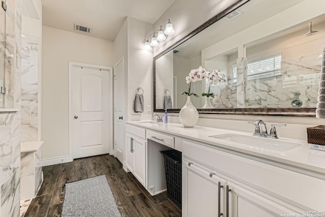 2215 Zachry, New Braunfels, TX 78132 - full bathroom featuring wood finished floors, a walk in shower, and double vanity