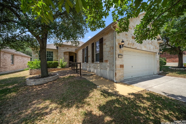 12518 Cascade Hls, San Antonio, TX 78253 - view of front of house with stone siding, driveway, and a garage