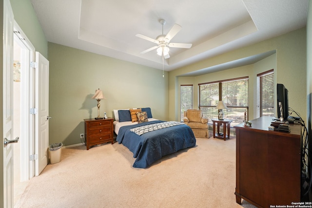 12518 Cascade Hls, San Antonio, TX 78253 - carpeted bedroom featuring a raised ceiling, a ceiling fan, and baseboards