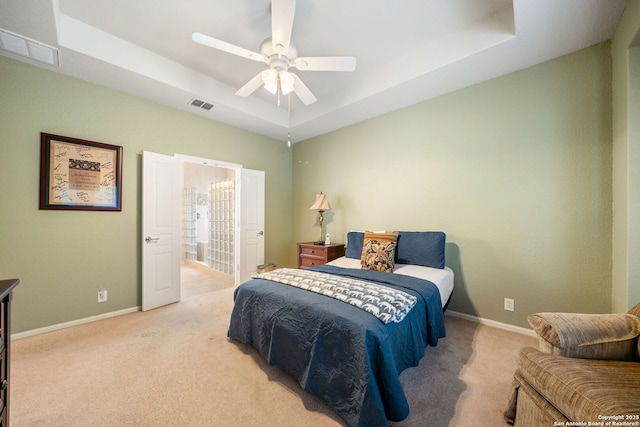 12518 Cascade Hls, San Antonio, TX 78253 - bedroom with a tray ceiling, light colored carpet, and baseboards