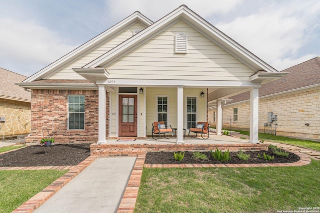 1459 Janets, New Braunfels, TX 78130 - view of front facade featuring a porch, brick siding, and a front yard