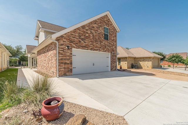 1459 Janets, New Braunfels, TX 78130 - view of home's exterior with brick siding, driveway, and a shingled roof