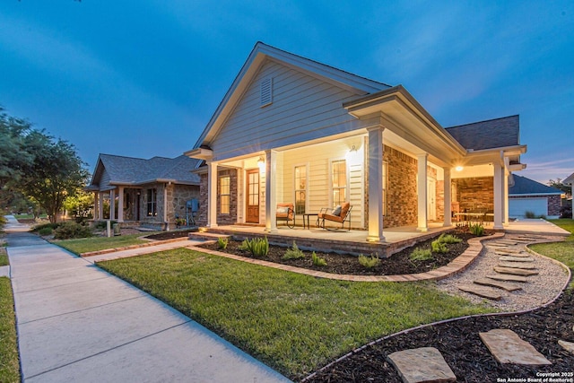 1459 Janets, New Braunfels, TX 78130 - rear view of property featuring covered porch, a lawn, and roof with shingles