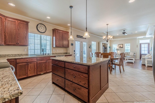 1459 Janets, New Braunfels, TX 78130 - kitchen featuring a sink, light tile patterned floors, ornamental molding, recessed lighting, and pendant lighting