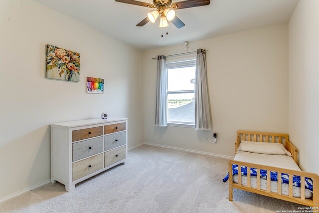 7010 Whipsaw Pt, San Antonio, TX 78253 - carpeted bedroom with baseboards and a ceiling fan