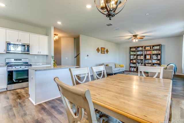 7010 Whipsaw Pt, San Antonio, TX 78253 - dining room with wood finished floors, recessed lighting, ceiling fan, and a chandelier
