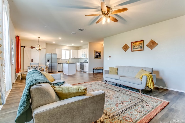 7010 Whipsaw Pt, San Antonio, TX 78253 - living area featuring ceiling fan, light wood-type flooring, recessed lighting, baseboards, and a chandelier