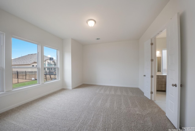103 Valencia, Boerne, TX 78006 - spare room featuring light colored carpet and baseboards