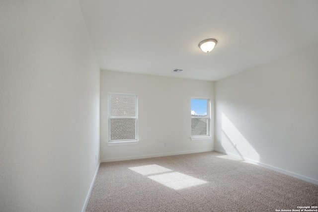 103 Valencia, Boerne, TX 78006 - unfurnished room featuring light carpet and baseboards