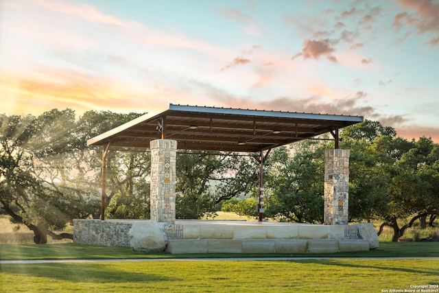 103 Valencia, Boerne, TX 78006 - yard at dusk featuring a lawn
