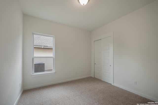 103 Valencia, Boerne, TX 78006 - unfurnished bedroom featuring carpet floors, baseboards, and a closet
